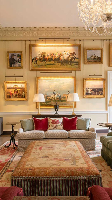 Interior of luxury antique lounge room with fireplace at hotel